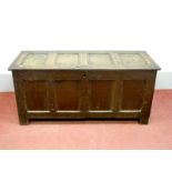 A Late XVII Century Oak Blanket Box, with four panelled top and base, on stile feet, 60cm high,