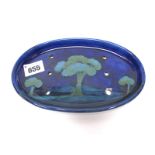 A Moorcroft Pottery Soap Dish, of oval form with six pierced holes, painted in the 'Moonlit Blue'