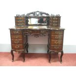 An Early XX Century Mahogany Serpentine Shaped Ladies Dressing Table, the upper section with pierced