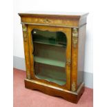 A XIX Century Walnut Pier Cabinet, with marquetry inlay and ormolu mounts, on stepped base, 108cm