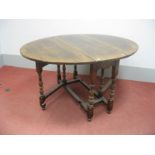 A Titchmarsh & Goodwin Style Oak Gateleg Table, with oval top, on turned and block supports,