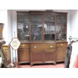 An Early XIX Century and Later Mahogany Breakfronted Secretaire Bookcase, with stepped pediment,