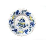 A Late XVII Century Dutch Delft Royal Commemorative Dish, of fluted circular form, painted in