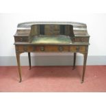 A XX Century Carlton House Desk, with galleried top, leather sciver, three central drawers and