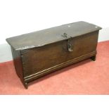 A Mid XVII Century Oak Blanket Box, with hinged lid, candle box, iron lock plate, moulding to front,