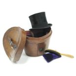 An Austin Reed Ltd Gentleman's Black Top Hat, contained in a brown leather box, with brush.
