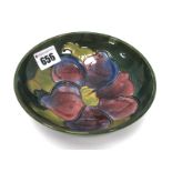 A Moorcroft Pottery Bowl, of footed circular form, painted in the 'Anemone' pattern against a