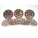 Eight Royal Crown Derby Imari Pattern 1128 Dinner Plates, dates code for 1979 and 2011, printed