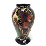 A Moorcroft Prestige Pottery Vase, of baluster form, painted in the 'Queens Choice' pattern on a