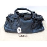 Chloe; A Paddington Metallic Blue Leather Handbag, dual rolled leather top handles, black tone
