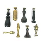 A Collection of Eight Late XIX Century Wood and Brass Seals, including a seal in the form of a hand,