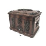 A Late XIX Century Oak Humidor, of serpentine outline with bronzed panels cast with hunting scenes
