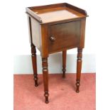 A XIX Century Mahogany Pot Cupboard, with three-quarter gallery back, cupboard door, on turned legs,
