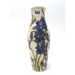 A Moorcroft Pottery Vase, of cream form, painted in the 'Delphinium' pattern against a cream ground,