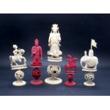 A Late XIX Century Canton Thirty-Two Piece Chess Set, half stained red, on puzzle ball bases,