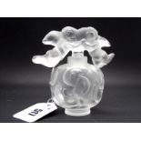 A Modern Lalique Glass Scent Bottle and Stopper, modelled in the 'Nuages' design of cherubs and