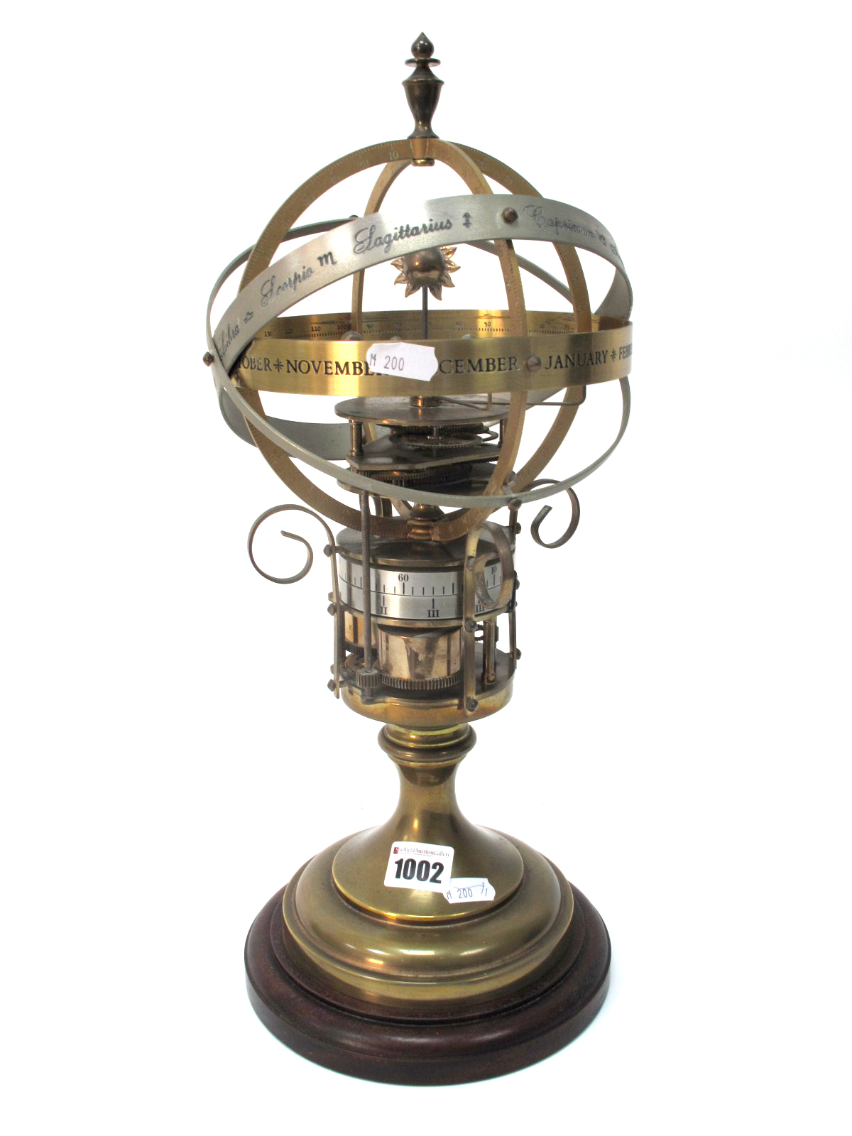 A Devon Clocks Brass Orrery Clock, showing the changing of the planets in conjunction with the stars