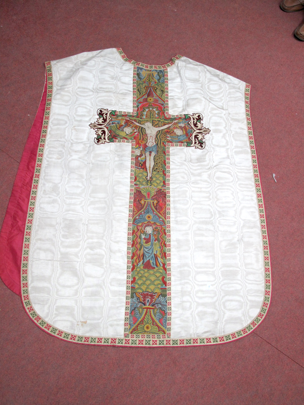 An Late XIX Century Chasuble, the front with a panel of crewelwork embroidery depicting the three