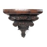 A XIX Century Rosewood Wall Bracket, of stepped rectangular form, elaborately carved with
