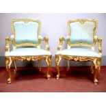 A Pair of XVIII Century French Style Gilt Wood Armchairs, with a shaped top rail, upholstered
