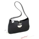 Salvatore Ferragamo: A Black Leather Handbag, with silver tone magnetic chain clasp fastener and