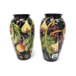 A Pair of Moorcroft Pottery Vases, of baluster form, painted in the 'Queens Choice' pattern