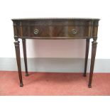 An Early XX Century Waring & Gillow Mahogany Bow Fronted Serving Table, with a gadrooned edge,