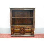 A Titchmarsh & Goodwin Style Oak Bookcase, with single shelf and fielded panels, 97cm high, 84cm