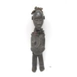 Tribal Art: A Songye Nkisi Power Figure or Fetish, wearing tasselled cap and collar, standing