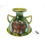 A Minton Secessionist Pottery Art Nouveau Candlestick, the dome shaped two handled body with short