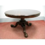 A XIX Century Mahogany Breakfast Table, the circular top with moulded edge, on carved cabriole