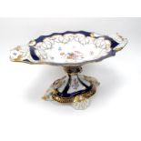 A Modern Continental Porcelain Centrepiece Bowl, of fluted oval form raised on spreading footed