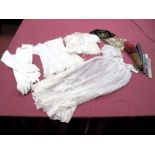 An Early XX Century Baby's Cream Silk Dress, overlaid with ribbon trimmed net, with scalloped hem