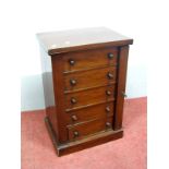 A XIX Century Miniature Wellington Chest, with five small drawers, on a plinth base, 53cm high, 36cm