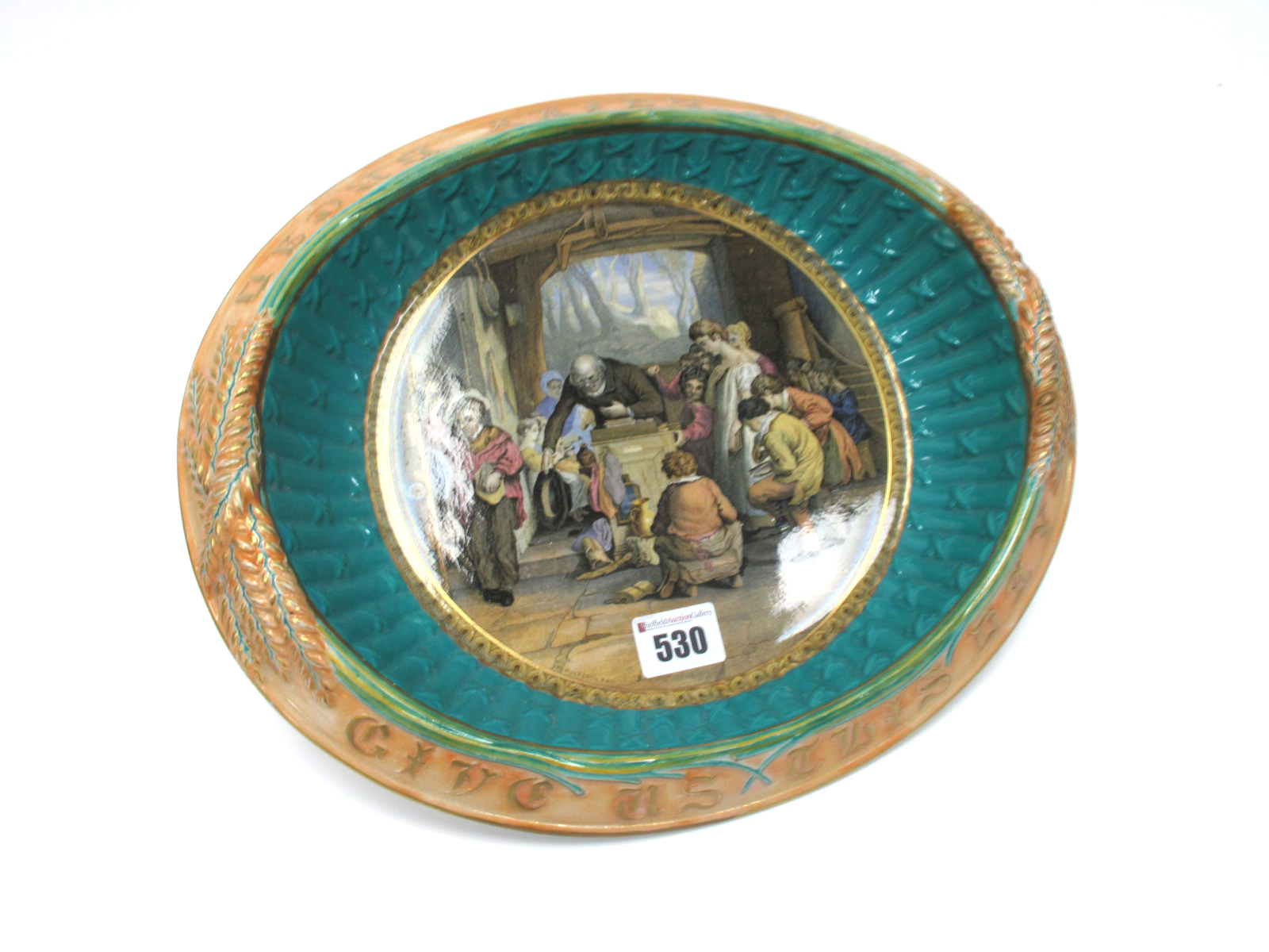 A Mid XX Century Prattware Bread Plate, of dished oval form, the rim inscribed "Give Us This Day Our