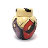 A Moorcroft Pottery Ginger Jar and Cover, painted in the 'Birdhouses' pattern against a cream and