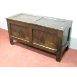 An Early XVIII Century Joined Oak Blanket Box, with panelled top and base, on stile feet, 117cm