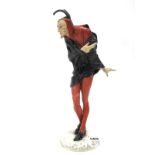 A Hutschenreuther Porcelain Figure of "Mephistopheles", wearing a red and black costume and a