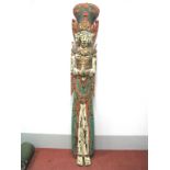 A Large Indonesian Carved Wood Temple Goddess, in a standing pose, her hands clasped, brightly