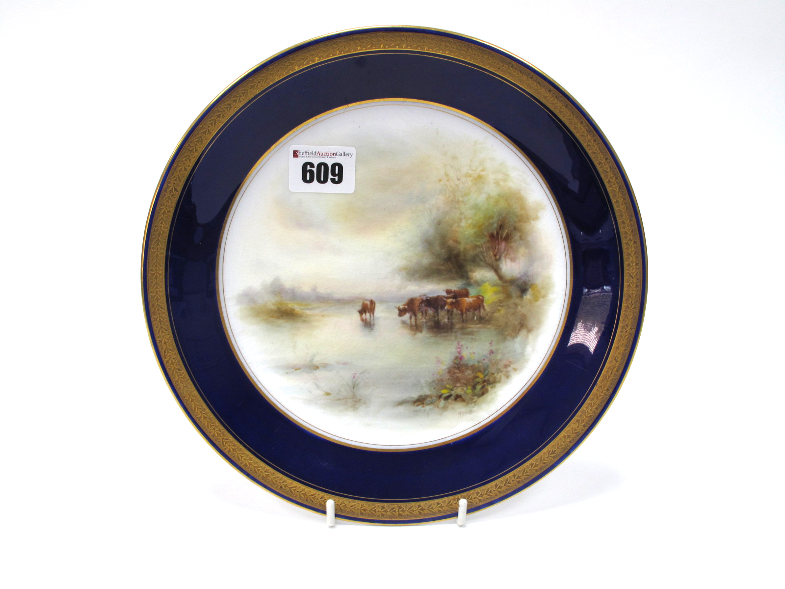 A Royal Worcester Porcelain Plate, of circular form, painted by Harry Stinton, signed, with cattle