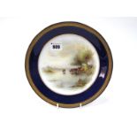 A Royal Worcester Porcelain Plate, of circular form, painted by Harry Stinton, signed, with cattle