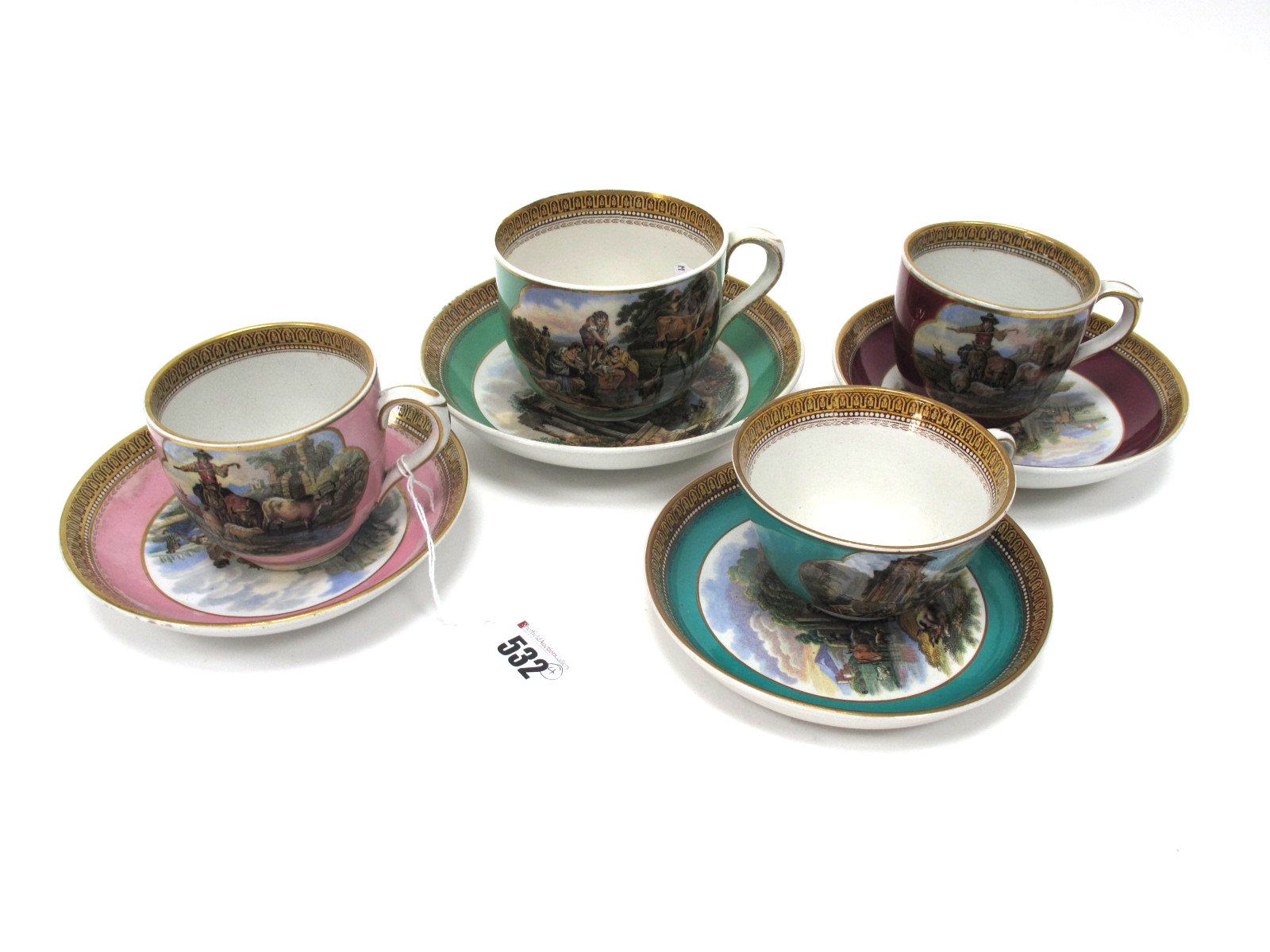 Four Mid XIX Century Prattware Teacups and Saucers, decorated with printed scenes within a gilt