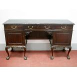 An Early XX Century Mahogany Sideboard, with gadrooned carved border, three drawers over twin