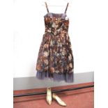 A 1950's Cocktail Dress by Alma Leigh, in brown floral lamé fabric over layers of contrasting net,