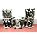 Four Early/Mid XX Century Wood Bound Metal Marching Drums, the black body each inscribed in white "