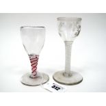 An XVIII Century Wine Glass, the ogee bowl etched with floral sprigs within a swag border, raised on