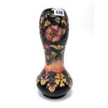 A Moorcroft Pottery Vase, of waisted baluster form, painted in the 'Honeysuckle' pattern against a