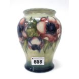 A Moorcroft Pottery Vase, of baluster form, painted in the 'Anemone' pattern against a shaded