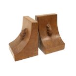 A Pair of Robert 'Mouseman' Thompson Oak Bookends, with carved signature mouse, 15cm high. (2)