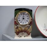 A Moorcroft Clock, painted in the 'Anna Lily' pattern, designed by Nicola Slaney, impressed and